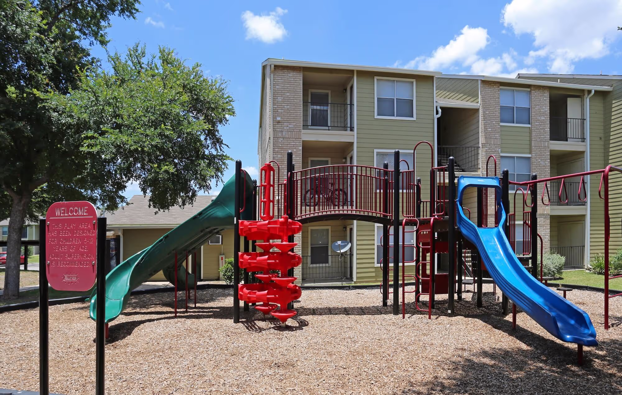 The playground at Avalon Apartments with colorful slides